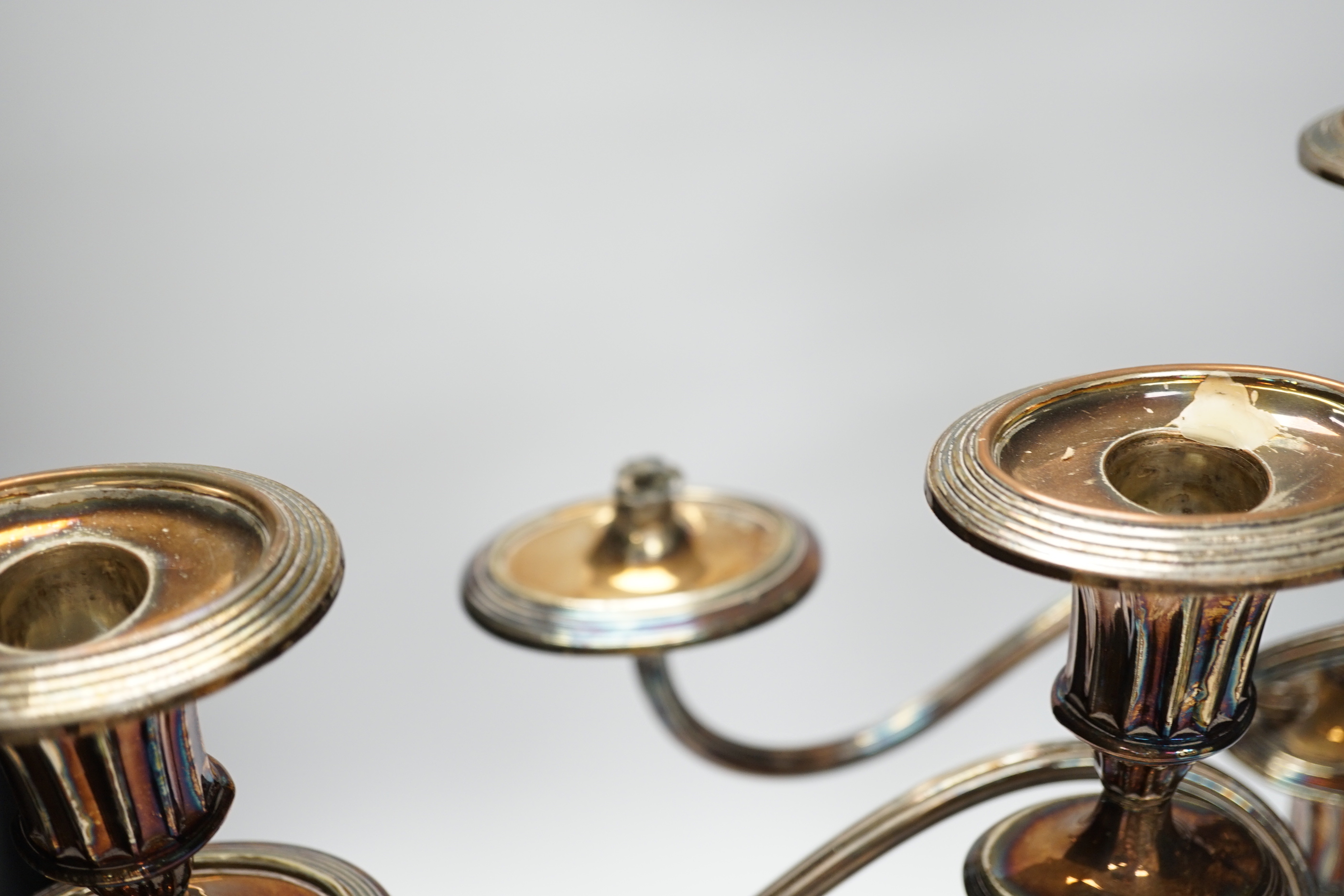 A pair of silver plate two branch candelabra